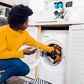Black woman doing laundry [iStock]