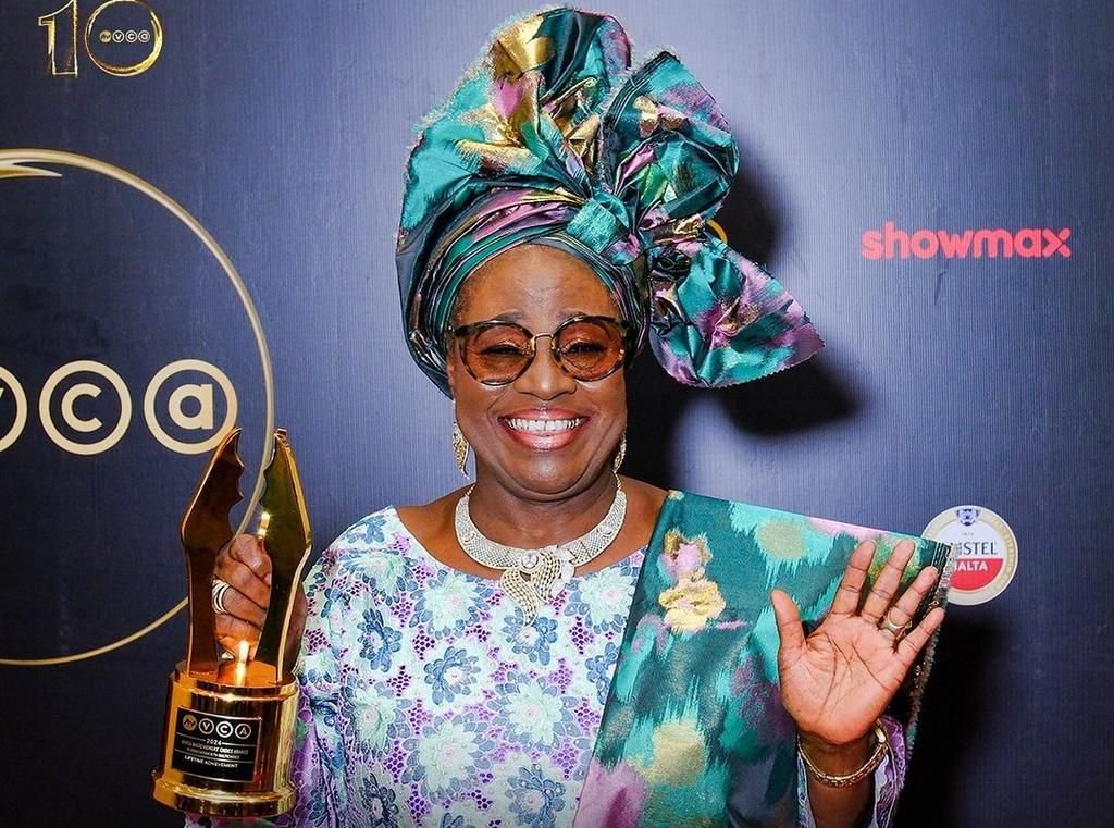 Idowu Philips, aka Iya Rainbow, with her Industry Merit award at the 2024 AMVCA [Africa Magic]