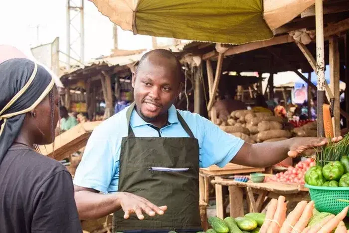 A male fruit seller [Depositphotos]
