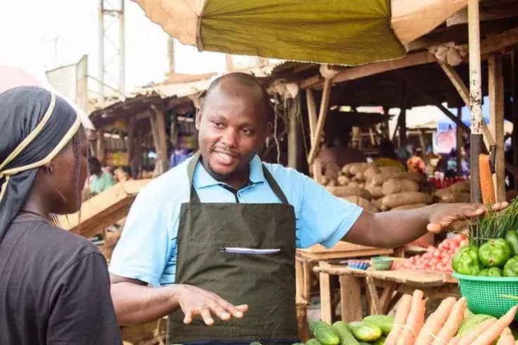 A male fruit seller [Depositphotos]