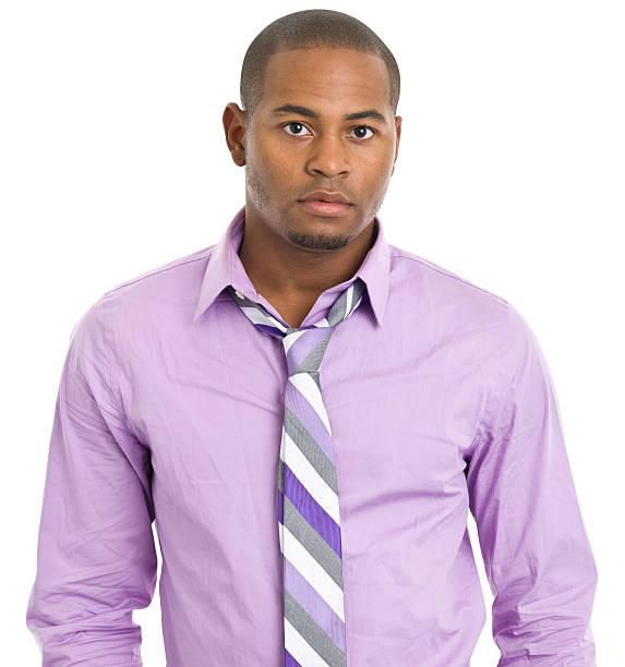 A man with a loose neck tie