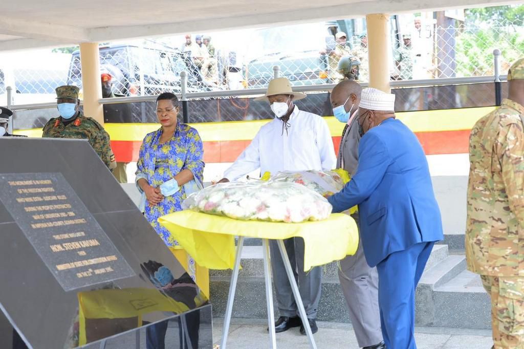 President Museveni flacked by House Speaker Anitah Among honoring the fallen NRA heros