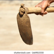 A hand holding a hoe [Shutterstock]