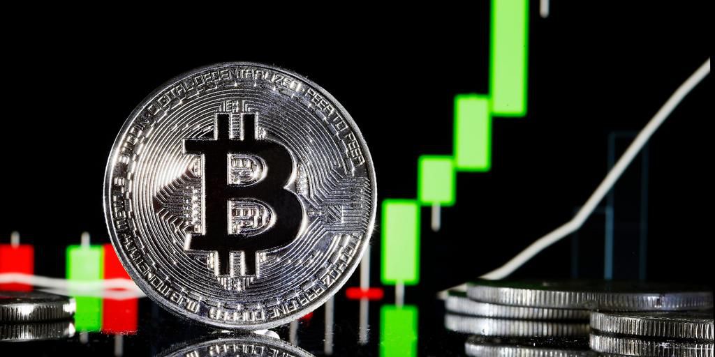 A visual representation of the digital Cryptocurrency, Bitcoin is on display in front of the Bitcoin course's graphChesnot/Getty Images