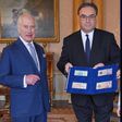 King Charles III (left) is presented with the first bank notes featuring his portrait from the Bank of England Governor Andrew Bailey and Sarah John, the Bank of England's Chief Cashier, at Buckingham Palace, April 9, 2024 in London, England. [Getty Im...