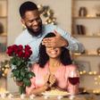 A romantic man giving her woman a flower