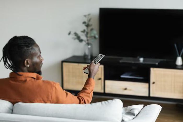 A man watching TV