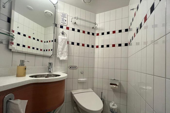 The half bathroom included a toilet and a sink. Lauren Mack