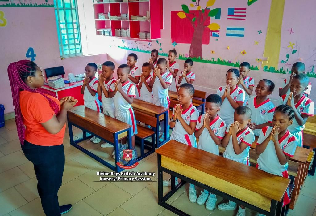 Divine Rays British School pupils in class with their teacher. [Facebook:DRBS]