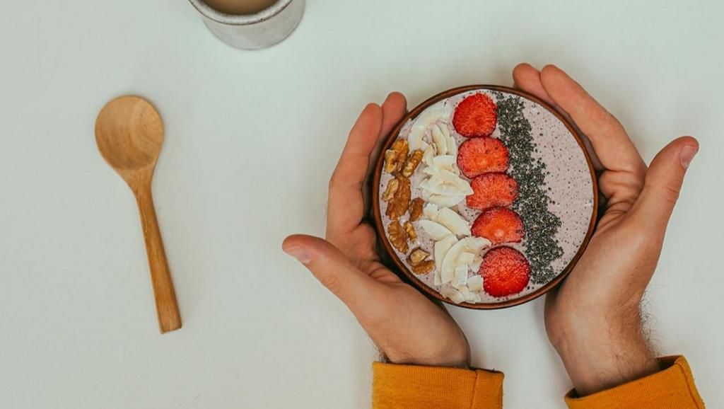 A bowl of oatmeal with Chia seeds, nuts, and berries [Image Credit: Cup of Couple]