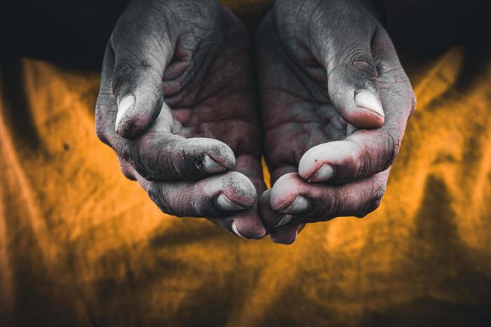 Black begging hands [Vecteezy]