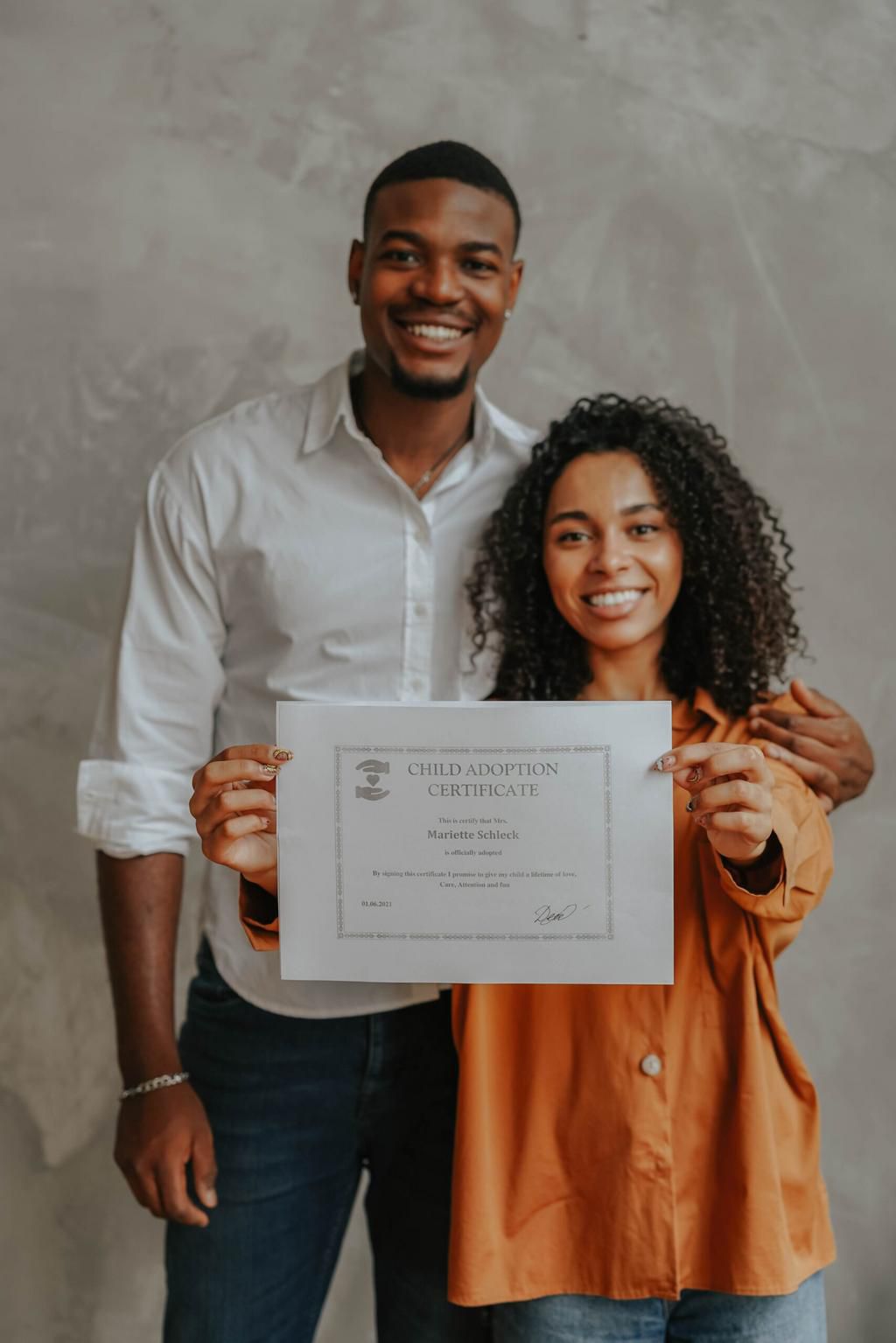 A young couple with a certificate
