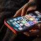 iPhone screen showing various social media apps including TikTok, Facebook and X.Matt Cardy