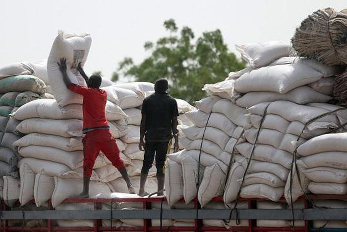Bags of maize being offloaded from a truck. [Channels TV]