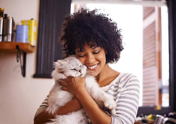 A woman having a good time with a cat