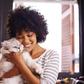 A woman having a good time with a cat