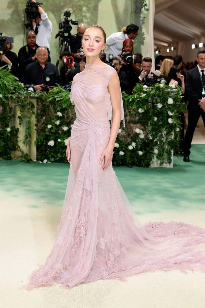 Phoebe Dynevor looked pretty in pink with her sheer gown.