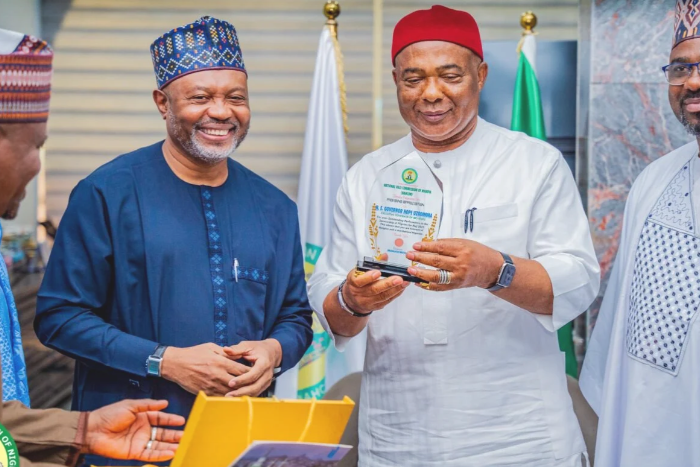 NAHCON officials with Imo State Governor, Hope Uzodinma holding the award presented to him. [NAN]