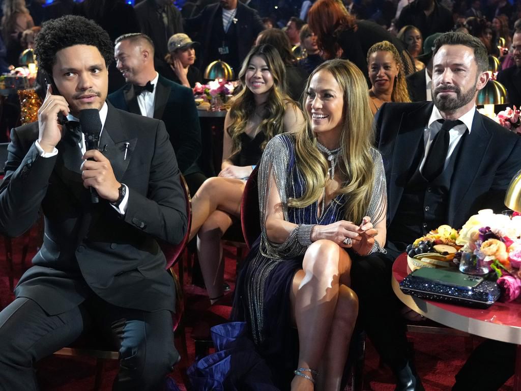 (L-R) Trevor Noah, Jennifer Lopez, and Ben Affleck at 2023 Grammy Awards.Kevin Mazur/Getty