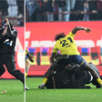 Super Eagles Bright Osayi-Samuel punches pitch invader as violence erupts following Trabzonspor vs Fenerbahce