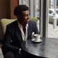 Black man sitting in a cafe [Nohat]