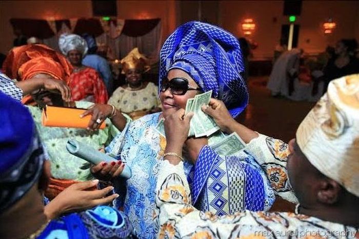 The CBN frowns at spraying of naira notes.