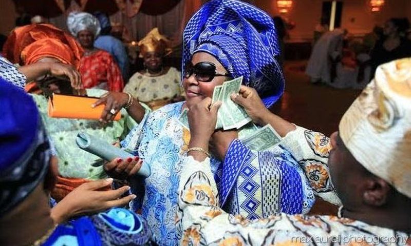 The CBN frowns at spraying of naira notes.