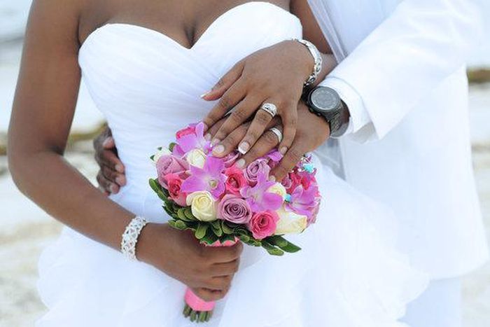 Black bride and groom on wedding day [Adobe Stock]