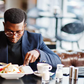 A well-dressed man dining in a restaurant