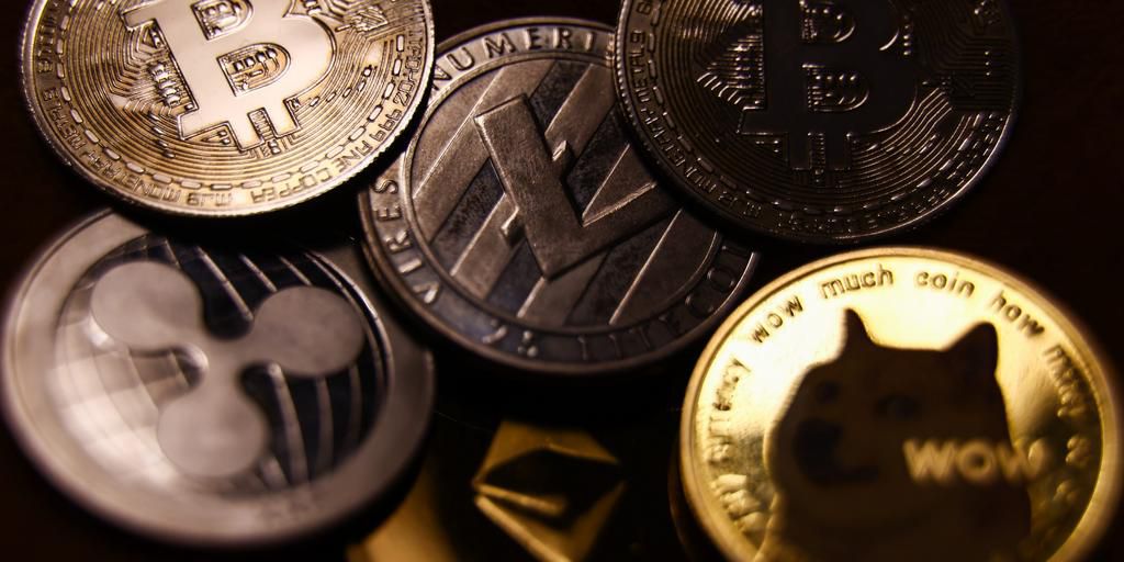 A representation of cryptocurrencies including bitcoin and dogecoin are seen in this illustration photo.Jakub Porzycki/NurPhoto via Getty Images