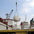 In this file photo taken on January 27, 2018, workers unload wheat assistance provided by UNICEF from a cargo ship in the Red Sea port of Hodeida, a key entry point for United Nations aid to war-torn Yemen