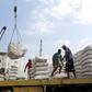 In this file photo taken on January 27, 2018, workers unload wheat assistance provided by UNICEF from a cargo ship in the Red Sea port of Hodeida, a key entry point for United Nations aid to war-torn Yemen