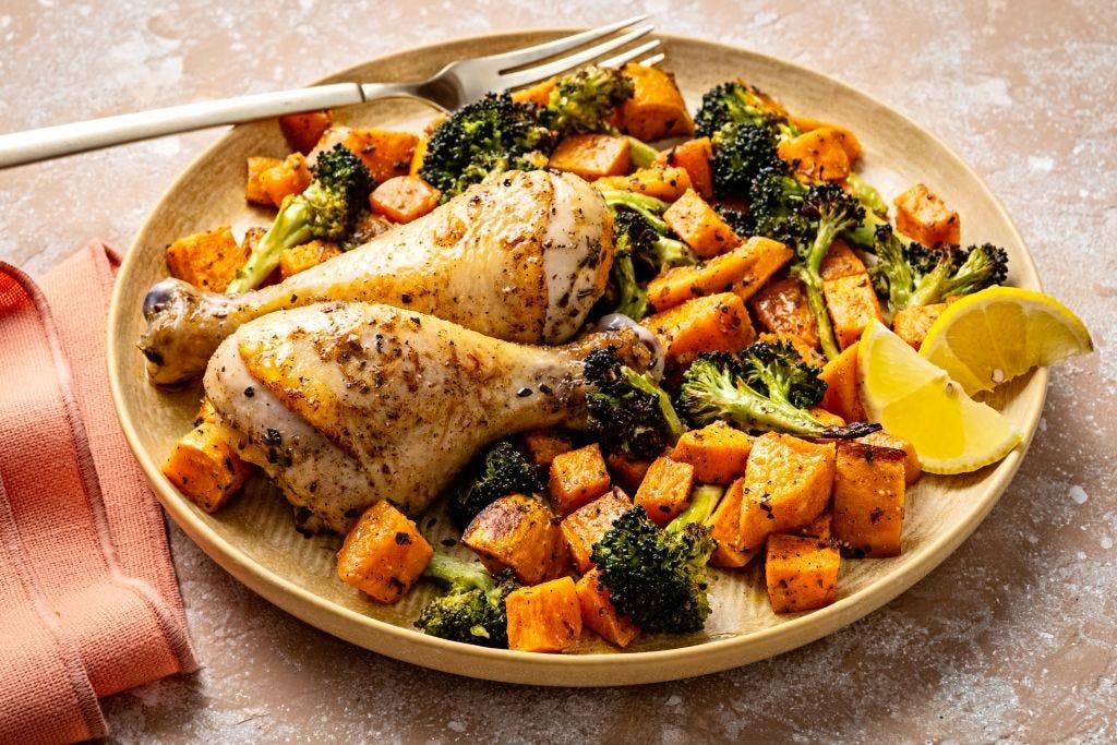 Adding sweet potato to a meal of chicken drumsticks and broccoli makes it a more balanced plate.The Washington Post/Getty Images