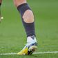 Why do so many footballers cut holes in their socks? [huffpost]