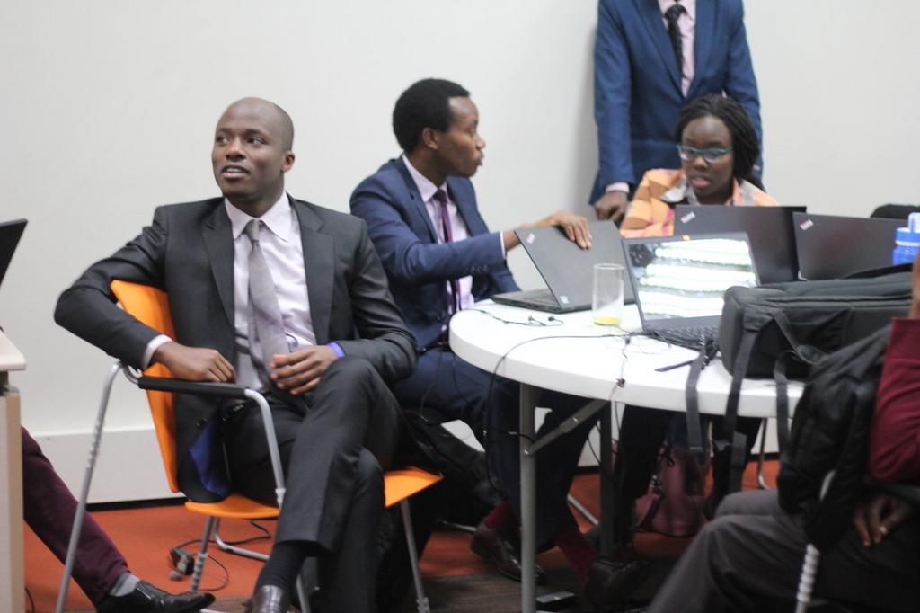 A group of people at a workplace setting