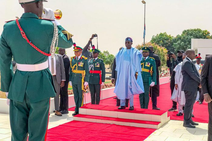 President Bola Tinubu inspects the guard of honour at the 60th anniversary of the Nigerian Defence Academy, Kaduna.  [Twitter:@NDefenceAcademy]