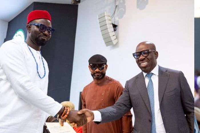 Edo State Governor, Godwin Obaseki (R), congratulates his new deputy, Omobayo Godwins (L), in Benin City, the state capital, on Monday, April 8, 2024 in the presence of admirers . [Channels TV:
