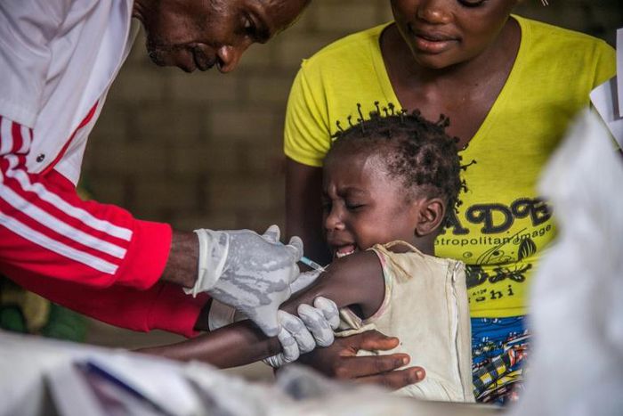 A toddler gets a measles vaccination in western DR Congo last month but further north in Chad the vaccination programme has been hit by the COVID-19 pandemic