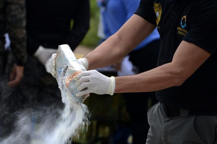 Anti-narcotics and military police officers prepare for the incineration of more than 200 kilos of cocaine seized in southern Honduras near the border with Nicaragua, August 5, 2016.Getty Images