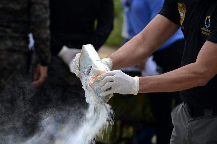 Anti-narcotics and military police officers prepare for the incineration of more than 200 kilos of cocaine seized in southern Honduras near the border with Nicaragua, August 5, 2016.Getty Images