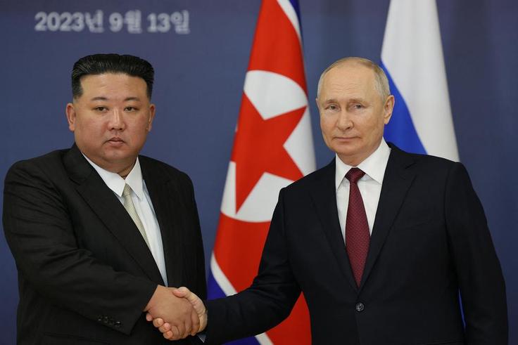 Russian President Vladimir Putin (R) and North Korea's leader Kim Jong Un (L). [Getty Images]