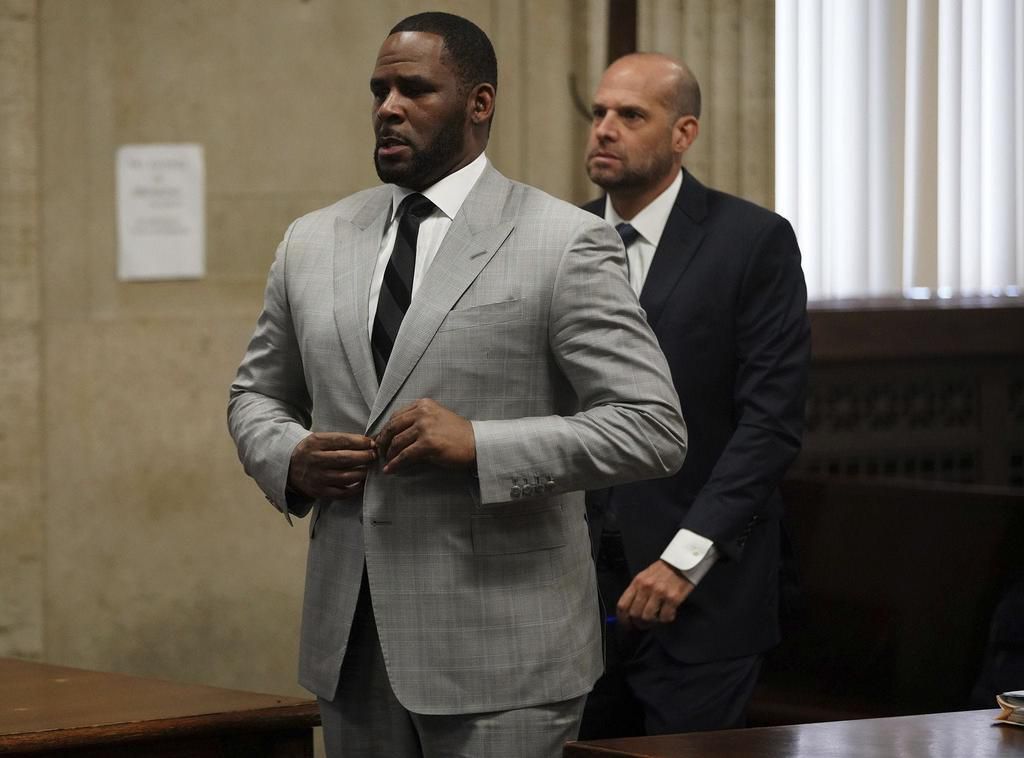R. Kelly, left, stands in court before Judge Lawrence Flood at Leighton Criminal Court Building in Chicago on June 6, 2019.E. Jason Wambsgans/Chicago Tribune/Tribune News Service via Getty Images