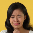 A Chinese woman crying [Shutterstock]