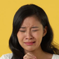 A Chinese woman crying [Shutterstock]