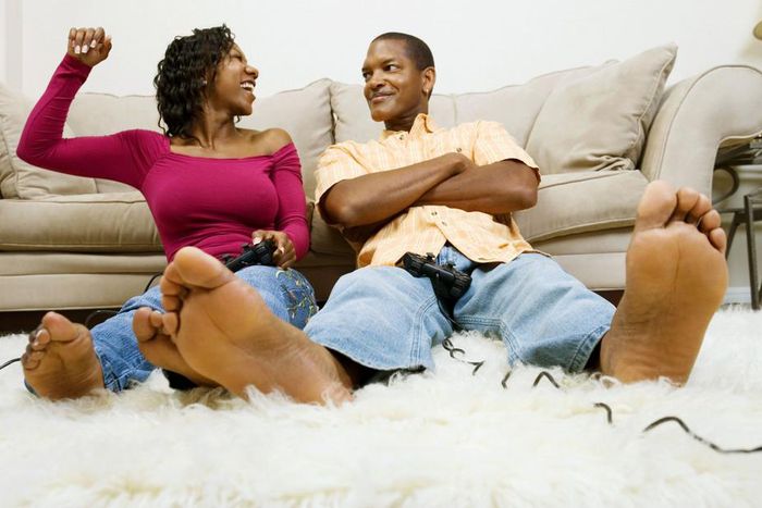 Man and woman playing video game