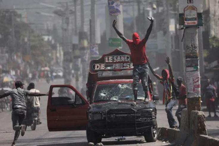 Violence rocked the streets of Haiti's Capital Port-Au-Prince with armed gangs taking on the police
