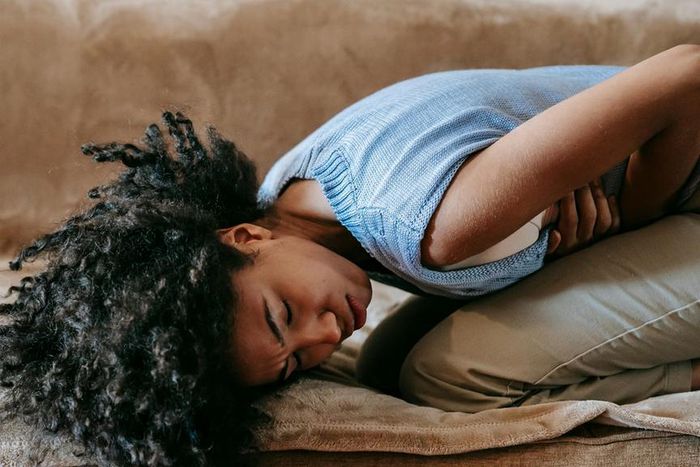 Woman suffering from abdominal pain [Image Credit: Sora Shimazaki]