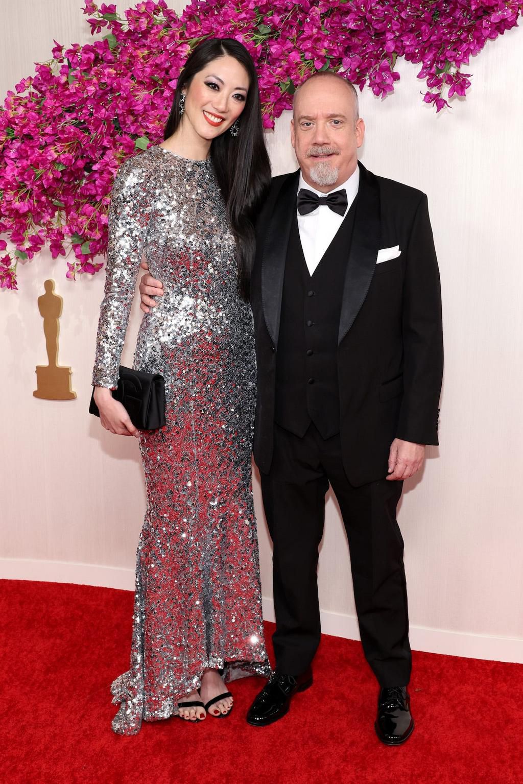 Paul Giamatti walked the red carpet with his partner, Clara Wong, who dazzled in a metallic silver gown.
