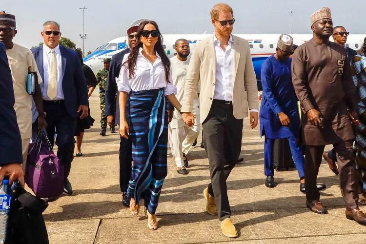 Harry and Meghan in Nigeria [Andrew Esiebo/Getty]
