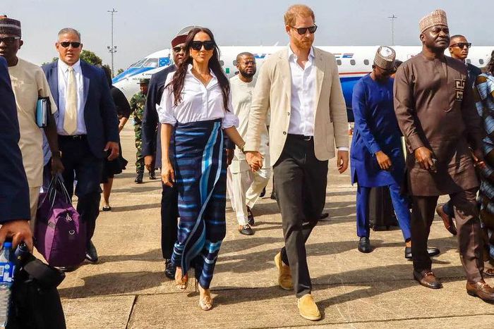 Harry and Meghan in Nigeria [Andrew Esiebo/Getty]